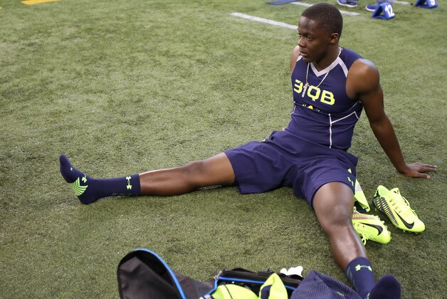 Feb 23, 2014; Indianapolis, IN, USA; Louisville Cardinals quarterback  Teddy Bridgewater stretches prior to work out during the 2014 NFL Combine at Lucas Oil Stadium. Mandatory Credit: Brian Spurlock-USA TODAY Sports