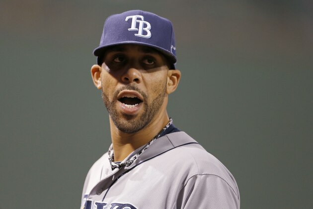 Tampa Bay Rays starting pitcher David Price talks to a teammate in the seventh inning in Game 2 of baseball's American League division series against the Boston Red Sox Saturday, Oct. 5, 2013, in Boston. (AP Photo/Michael Dwyer)