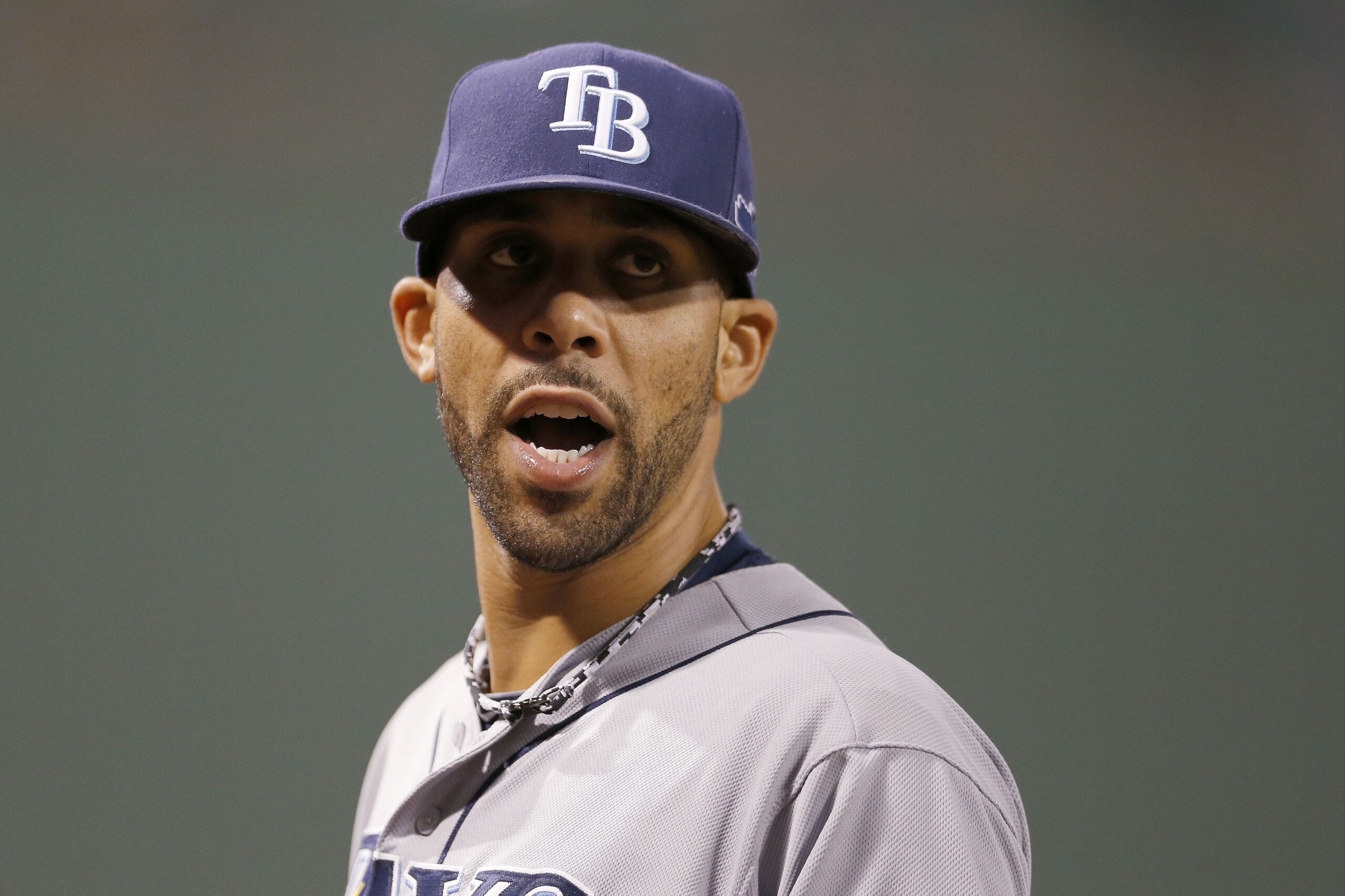 Tampa Bay Rays starting pitcher David Price talks to a teammate in the seventh inning in Game 2 of baseball's American League division series against the Boston Red Sox Saturday, Oct. 5, 2013, in Boston. (AP Photo/Michael Dwyer)