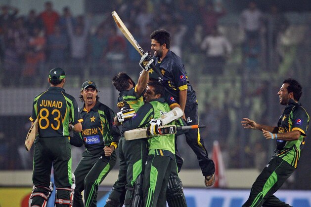 Pakistan’s team celebrates after winning the Asia Cup one-day international cricket tournament against India in Dhaka, Bangladesh, Sunday, March 2, 2014. Pakistan won by 1 wicket. (AP Photo/A.M. Ahad)