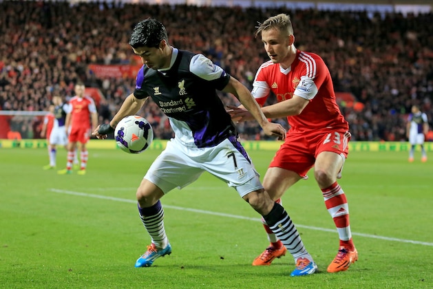 SOUTHAMPTON, ENGLAND - MARCH 01: Luke Shaw of Southampton challenges Luis Suarez of Liverpool during the Barclays Premier League match between Southampton and Liverpool at St Mary's Stadium on March 1, 2014 in Southampton, England. (Photo by David Cannon/Getty Images) SOUTHAMPTON, ENGLAND - MARCH 01: Luke Shaw of Southampton challenges Luis Suarez of Liverpool during the Barclays Premier League match between Southampton and Liverpool at St Mary's Stadium on March 1, 2014 in Southampton, England. (Photo by David Cannon/Getty Images)
