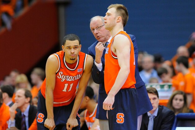 SYRACUSE, NY - FEBRUARY 19:  (L-R) Tyler Ennis #11, head coach Jim Boeheim and Trevor Cooney #10 of the Syracuse Orange talk against the Boston College Eagles during the second half at the Carrier Dome on February 19, 2014 in Syracuse, New York.  Boston College defeated Syracuse 62-59 in overtime.  (Photo by Rich Barnes/Getty Images)