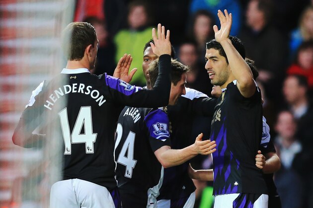 SOUTHAMPTON, ENGLAND - MARCH 01:  Luis Suarez (R) of Liverpool celebrates scoring the opening goal with team mates during the Barclays Premier League match between Southampton and Liverpool at St Mary's Stadium on March 1, 2014 in Southampton, England.  (Photo by David Cannon/Getty Images)