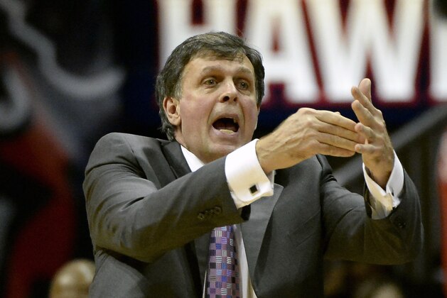 Houston Rockets head coach Kevin McHale tries to call a timeout as they fall behind the Atlanta Hawks in the second half of an NBA basketball game on Friday, Jan. 10, 2014, in Atlanta. Atlanta won 83-80. (AP Photo/David Tulis)