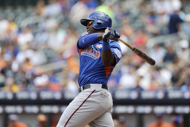 World's Miguel Sano grounds out in the second inning of the All-Star Futures baseball game against the United States on Sunday, July 14, 2013, in New York. (AP Photo/Kathy Willens)