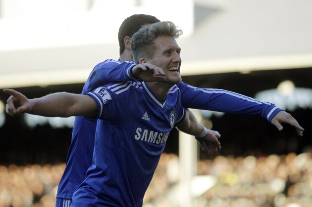 Chelsea's Andre Schurrle celebrates his third goal against Fulham with teammate Eden Hazard during their English Premier League soccer match at Craven Cottage, London, Saturday, March 1, 2014. (AP Photo/Sang Tan)