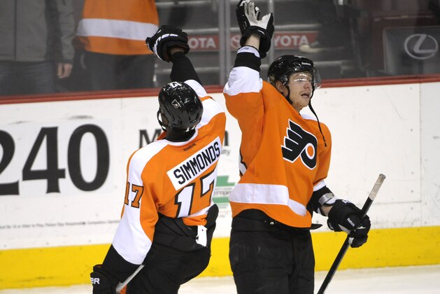 Mar 1, 2014; Philadelphia, PA, USA; Philadelphia Flyers right wing Jakub Voracek (93) and Philadelphia Flyers right wing Wayne Simmonds (17) celebrate win against the New York Rangers at Wells Fargo Center. The Flyers defeated the Rangers, 4-2. Mandatory Credit: Eric Hartline-USA TODAY Sports