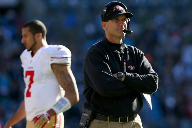 CHARLOTTE, NC - JANUARY 12: Head coach Jim Harbaugh of the San Francisco 49ers looks on in the second quarter as Colin Kaepernick #7 walks by against the Carolina Panthers during the NFC Divisional Playoff Game at Bank of America Stadium on January 12, 2014 in Charlotte, North Carolina. (Photo by Ronald Martinez/Getty Images) CHARLOTTE, NC - JANUARY 12: Head coach Jim Harbaugh of the San Francisco 49ers looks on in the second quarter as Colin Kaepernick #7 walks by against the Carolina Panthers during the NFC Divisional Playoff Game at Bank of America Stadium on January 12, 2014 in Charlotte, North Carolina. (Photo by Ronald Martinez/Getty Images)