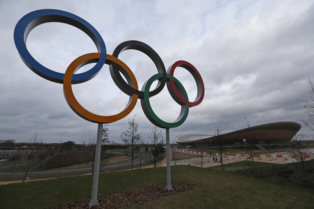 In this Sunday, Feb. 23, 2014 photo, the Olympic Rings are seen back dropped by the Velodrome in the Queen Elizabeth Olympic Park in east London. London continues to bask in the success of the most recent Summer Games, but the Olympic legacy is difficult to determine. The flagship venue, renamed the Queen Elizabeth Olympic Park, is being converted into a massive park as big as London’s famous Hyde Park, complete with wildlife habitats, woods and sports facilities. The first part of the ambitious project will begin to open to the public in April. The 80,000-seat Olympic Stadium at the center of the park has been troubled by controversy since even before the games, and its post-games use was the subject of months of legal wrangling. The stadium is now being converted into a soccer venue and the home of the West Ham soccer club, with an expected price tag of $323 million. Many argue taxpayers should not have to fund a Premier League club, though officials insist that the stadium will continue to host other major