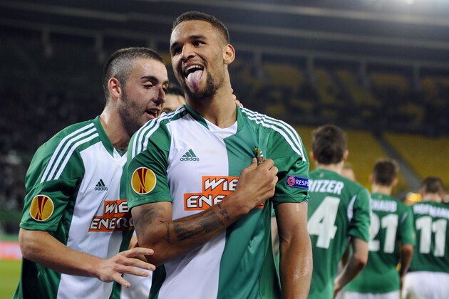 Rapid's Terrence Boyd, right, celebrates with Thanos Petsos after scoring during the  Europa League   group G soccer match between SK Rapid Vienna and KRC Genk, Vienna, Austria, Thursday, Nov. 7, 2013. (AP Photo/Hans Punz)p