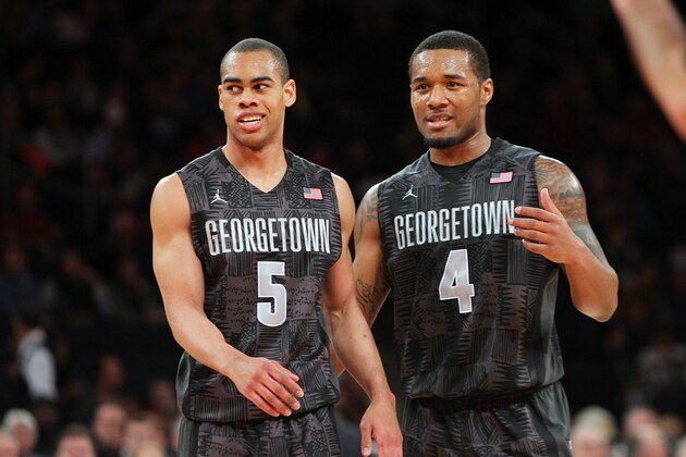 NEW YORK, NY - FEBRUARY 1:  Markel Starks #5 and D'Vauntes Smith-Rivera #4 of the Georgetown Hoyas cheer on the court during their win over the Michigan State Spartans during the game at Madison Square Garden on February 1, 2014 in New York City. (Photo by Nate Shron/Getty Images)