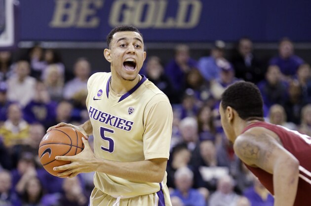 Washington's Nigel Williams-Goss directs his team against Washington State in the second half of an NCAA college basketball game Friday, Feb. 28, 2014, in Seattle. Washington won 72-49. (AP Photo/Elaine Thompson) Washington's Nigel Williams-Goss directs his team against Washington State in the second half of an NCAA college basketball game Friday, Feb. 28, 2014, in Seattle. Washington won 72-49. (AP Photo/Elaine Thompson)