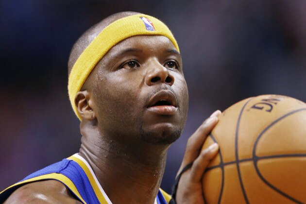 Golden State Warriors' Jermaine O'Neal takes aim at a free throw during the first half of an NBA basketball game against the Phoenix Suns Saturday, Feb. 8, 2014, in Phoenix.  The Suns defeated the Warriors 122-109. (AP Photo/Ross D. Franklin)
