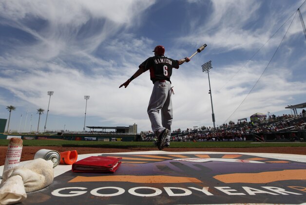 Cincinnati Reds' Billy Hamilton swings a bat in the on-deck circle before the first inning of an exhibition baseball game against the Cleveland Indians in Goodyear, Ariz., Wednesday, Feb. 26, 2014. (AP Photo/Paul Sancya)