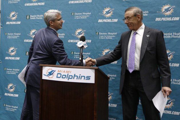 Dennis Hickey, new general manager for the Miami Dolphins football team, left, shakes hands with team owner Stephen Ross, right, during a news conference, Tuesday, Jan. 28, 2014, in Davie, Fla. (AP Photo/Lynne Sladky) Dennis Hickey, new general manager for the Miami Dolphins football team, left, shakes hands with team owner Stephen Ross, right, during a news conference, Tuesday, Jan. 28, 2014, in Davie, Fla. (AP Photo/Lynne Sladky)