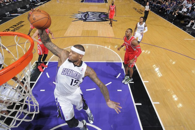 SACRAMENTO, CA - FEBRUARY 25: DeMarcus Cousins #15 of the Sacramento Kings rebounds against the Houston Rockets on February 25, 2014 at Sleep Train Arena in Sacramento, California. NOTE TO USER: User expressly acknowledges and agrees that, by downloading and or using this photograph, User is consenting to the terms and conditions of the Getty Images Agreement. Mandatory Copyright Notice: Copyright 2014 NBAE (Photo by Rocky Widner/NBAE via Getty Images)