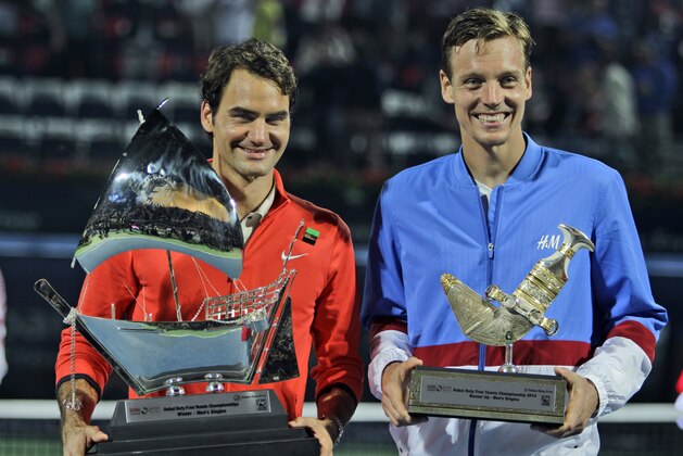 Roger Federer of Switzerland, left, and Tomas Berdych of Czech Republic display their trophies after Federer won the final match of the Dubai Duty Free Tennis Championships in Dubai, United Arab Emirates, Saturday, March 1, 2014. (AP Photo/Kamran Jebreili) Roger Federer of Switzerland, left, and Tomas Berdych of Czech Republic display their trophies after Federer won the final match of the Dubai Duty Free Tennis Championships in Dubai, United Arab Emirates, Saturday, March 1, 2014. (AP Photo/Kamran Jebreili)