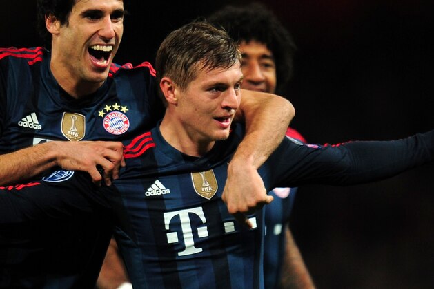 LONDON, ENGLAND - FEBRUARY 19:  Toni Kroos of Bayern Muenchen celebrates scoring the opening goal with Javi Martinez of Bayern Muenchen during the UEFA Champions League Round of 16 first leg match between Arsenal and FC Bayern Muenchen at Emirates Stadium on February 19, 2014 in London, England.  (Photo by Shaun Botterill/Getty Images)