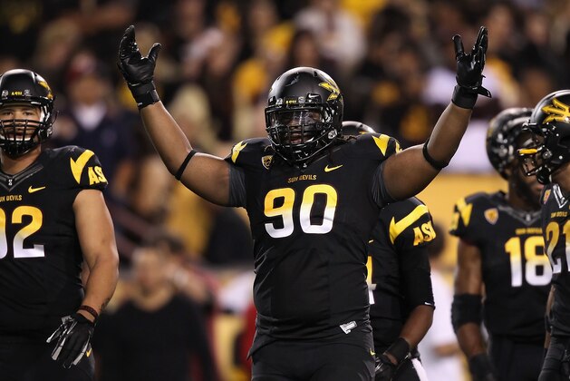 TEMPE, AZ - NOVEMBER 19:  Defensive tackle Will Sutton #90 of the Arizona State Sun Devils pumps up the crowd during the college football game against the Arizona Wildcats at Sun Devil Stadium on November 19, 2011 in Tempe, Arizona. The Wildcats defeated the Sun Devils 31-27.  (Photo by Christian Petersen/Getty Images)