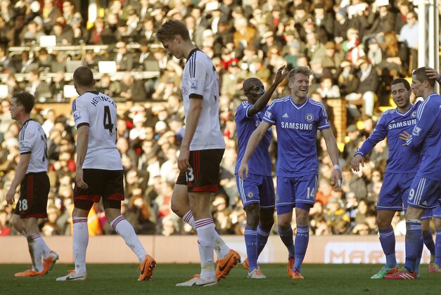 Chelsea's Andre Schurrle, third right, celebrates his second goal against Fulham with teammates during their English Premier League soccer match at Craven Cottage, London, Saturday, March 1, 2014. (AP Photo/Sang Tan)