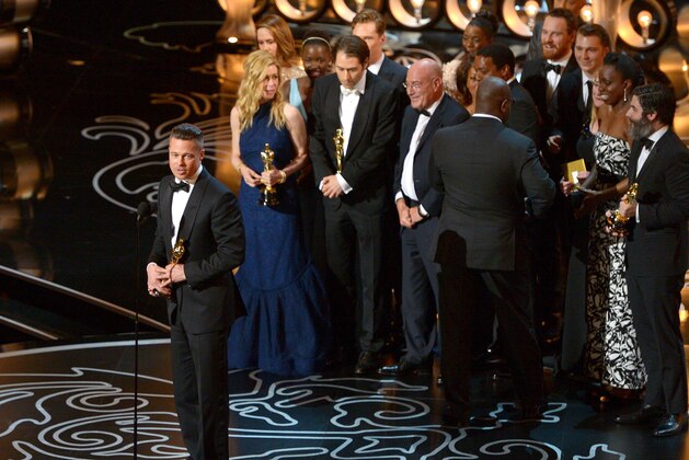 Brad Pitt, left, speaks as he and the cast and crew of
