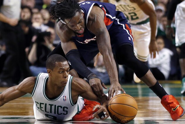 Boston Celtics point guard Rajon Rondo dives on the floor to beat Atlanta Hawks forward DeMarre Carroll to a loose ball during the first quarter of an NBA basketball game in Boston, Wednesday, Feb. 26, 2014. (AP Photo/Elise Amendola) Boston Celtics point guard Rajon Rondo dives on the floor to beat Atlanta Hawks forward DeMarre Carroll to a loose ball during the first quarter of an NBA basketball game in Boston, Wednesday, Feb. 26, 2014. (AP Photo/Elise Amendola)