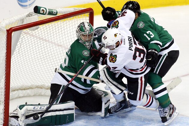 Dallas Stars goalie Kari Lehtonen, left, of Finland and Dallas Stars left wing Ray Whitney, right, keep Chicago Blackhawks center Brandon Pirri (37) from scoring during the second period of an NHL hockey game Saturday, Nov. 9, 2013, in Dallas, Texas. (AP Photo/Sharon Ellman)