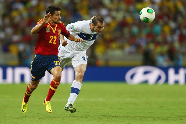 FORTALEZA, BRAZIL - JUNE 27: Jesus Navas of Spain competes with Giorgio Chiellini of Italy during the FIFA Confederations Cup Brazil 2013 Semi Final match between Spain and Italy at Castelao on June 27, 2013 in Fortaleza, Brazil. (Photo by Clive Mason/Getty Images) FORTALEZA, BRAZIL - JUNE 27: Jesus Navas of Spain competes with Giorgio Chiellini of Italy during the FIFA Confederations Cup Brazil 2013 Semi Final match between Spain and Italy at Castelao on June 27, 2013 in Fortaleza, Brazil. (Photo by Clive Mason/Getty Images)