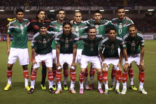 FILE- In this Oct. 15, 2013 file photo, Mexico's team poses prior to the start the 2014 World Cup qualifying soccer match between Costa Rica and Mexico, in San Jose, Costa Rica. Background from left: Hugo Ayala, Guillermo Ochoa, Rafael Marquez, Jorge Torres, Oribe Peralta, Jesus Zavala. Foreground from left, Christian Gimenez, Carlos Pena, Miguel Layun, Javier Aquino and Javier Hernandez. The draw for the 2014 World Cup finals takes place Friday Dec. 6, 2013 near Salvador, Brazil. The 32 teams will be drawn into eight groups of four. The top two in each group will progress to the knockout stages. Twelve stadiums in twelve cities will host matches. (AP Photo/Fernando Vergara, File) FILE- In this Oct. 15, 2013 file photo, Mexico's team poses prior to the start the 2014 World Cup qualifying soccer match between Costa Rica and Mexico, in San Jose, Costa Rica. Background from left: Hugo Ayala, Guillermo Ochoa, Rafael Marquez, Jorge Torres, Oribe Peralta, Jesus Zavala. Foreground from left, Christian Gimenez, Carlos Pena, Miguel Layun, Javier Aquino and Javier Hernandez. The draw for the 2014 World Cup finals takes place Friday Dec. 6, 2013 near Salvador, Brazil. The 32 teams will be drawn into eight groups of four. The top two in each group will progress to the knockout stages. Twelve stadiums in twelve cities will host matches. (AP Photo/Fernando Vergara, File)