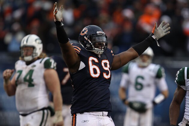 CHICAGO, IL - DECEMBER 26: Henry Melton #69 of the Chicago Bears celebrates after teammate Chris Harris intercepted a pass in the final minutes as Nick Mangold #74 and Mark Sanchez #6 of the New York Jets walk off of the field at Soldier Field on December 26, 2010 in Chicago, Illinois. The Bears defeated the Jets 38-34. (Photo by Jonathan Daniel/Getty Images) CHICAGO, IL - DECEMBER 26: Henry Melton #69 of the Chicago Bears celebrates after teammate Chris Harris intercepted a pass in the final minutes as Nick Mangold #74 and Mark Sanchez #6 of the New York Jets walk off of the field at Soldier Field on December 26, 2010 in Chicago, Illinois. The Bears defeated the Jets 38-34. (Photo by Jonathan Daniel/Getty Images)