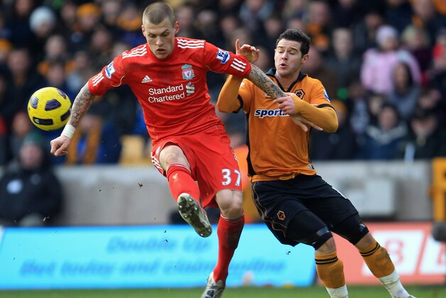 WOLVERHAMPTON, ENGLAND - JANUARY 22:  Matt Jarvis of Wolverhampton Wanderers tangles with  Martin Skrtl of Liverpool during the Barclays Premier League match between Wolverhampton Wanderers and Liverpool at Molineux on January 22, 2011 in Wolverhampton, England.  (Photo by Mark Thompson/Getty Images)