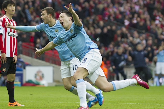 Manchester City's Samir Nasri, centre right, celebrates after scoring as Sunderland's Ki Sung-Yueng, left, looks on during the League Cup Final at Wembley Stadium, London, England, Sunday March 2, 2014. (AP Photo/Jon Super) Manchester City's Samir Nasri, centre right, celebrates after scoring as Sunderland's Ki Sung-Yueng, left, looks on during the League Cup Final at Wembley Stadium, London, England, Sunday March 2, 2014. (AP Photo/Jon Super)