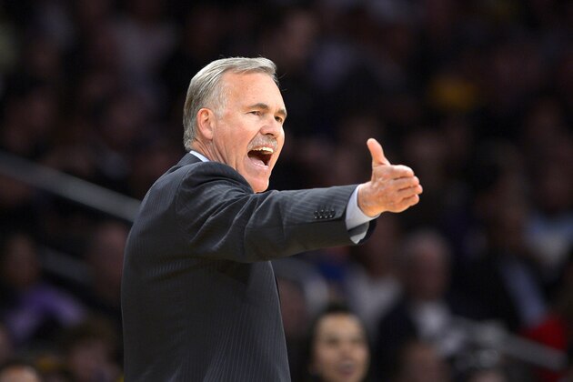 Los Angeles Lakers head coach Mike D'Antoni gestures during the second half of an NBA basketball game against the Sacramento Kings, Friday, Feb. 28, 2014, in Los Angeles. (AP Photo/Mark J. Terrill)
