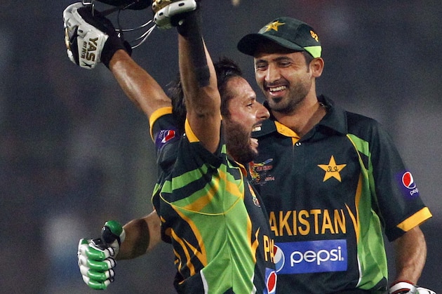 Pakistan’s Shahid Afridi, left, celebrates with a teammate after winning the Asia Cup one-day international cricket tournament against India in Dhaka, Bangladesh, Sunday, March 2, 2014. Pakistan won by 1 wicket. (AP Photo/A.M. Ahad)
