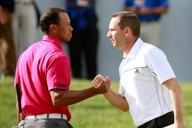 LAKE FOREST, IL - SEPTEMBER 14:  Tiger Woods (L) and Sergio Garcia of Spain shake hands on the 18th green during the Third Round of the BMW Championship at Conway Farms Golf Club on September 14, 2013 in Lake Forest, Illinois.  (Photo by Sam Greenwood/Getty Images)
