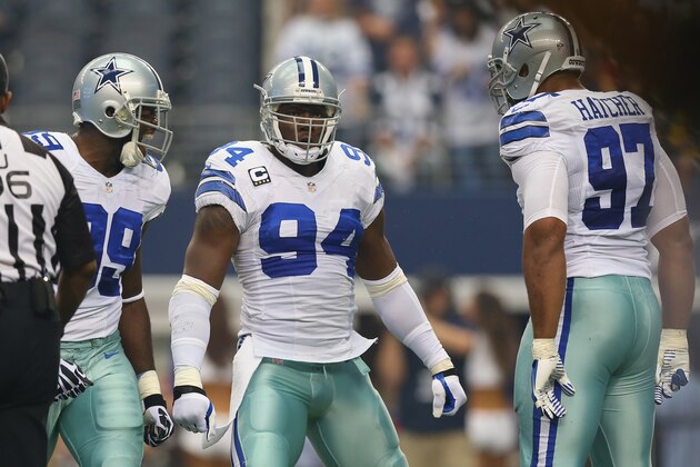 ARLINGTON, TX - SEPTEMBER 22:  DeMarcus Ware #94 of the Dallas Cowboys celebrates a sack against Sam Bradford #8 of the St. Louis Rams with  George Selvie #99 (left) and Jason Hatcher #97 at AT&T Stadium on September 22, 2013 in Arlington, Texas.  (Photo by Ronald Martinez/Getty Images)