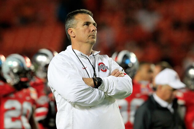 MIAMI GARDENS, FL - JANUARY 03:  Head coach Urban Meyer of the Ohio State Buckeyes looks on during warm ups prior to the Discover Orange Bowl against the Clemson Tigers at Sun Life Stadium on January 3, 2014 in Miami Gardens, Florida.  (Photo by Chris Trotman/Getty Images)