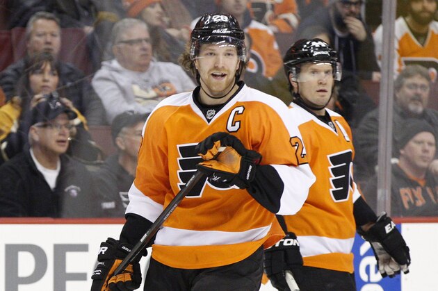 Philadelphia Flyers' Claude Giroux reacts to the call against him with Kimmo Timonen of Finland behind him during the first period of an NHL hockey game against the Boston Bruins, Saturday, Jan. 25, 2014, in Philadelphia.  The Bruins win 6-1.  (AP Photo/Chris Szagola)
