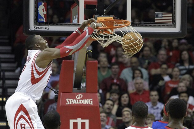 Houston Rockets center Dwight Howard dunks against the Detroit Pistons during the first half of an NBA basketball game, Saturday, March 1, 2014, in Houston. (AP Photo/Bob Levey)