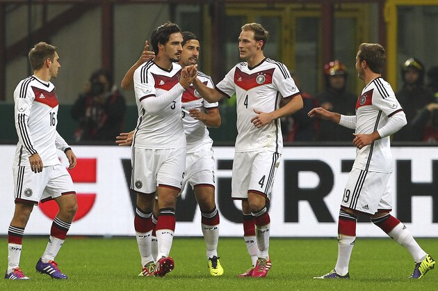 MILAN, ITALY - NOVEMBER 15:  Mats Hummels (L) of Germany celebrates with his team-mates Sami Khedira (C) and Benedikt Howedes (R) after scoring the opening goal during the international friendly match between Italy and Germany at Giuseppe Meazza Stadium on November 15, 2013 in Milan, Italy.  (Photo by Marco Luzzani/Getty Images)