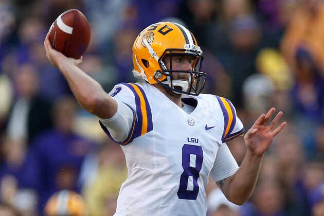 BATON ROUGE, LA - NOVEMBER 29:  Quarterback Zach Mettenberger #8 of the LSU Tigers throws a a pass against the Arkansas Razorbacks at Tiger Stadium on November 29, 2013 in Baton Rouge, Louisiana.  (Photo by Chris Graythen/Getty Images)