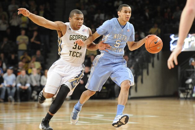 Georgia Tech guard Corey Heyward (30) and North Carolina guard Marcus Paige (5) are shown during an NCAA college basketball game, Wednesday, Jan. 29, 2014, in Atlanta. North Carolina won 78-65. (AP Photo/John Amis)