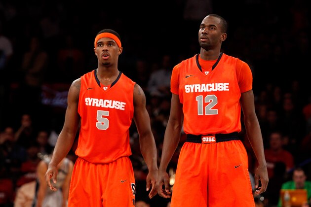 NEW YORK, NY - MARCH 15:  (L-R) C.J. Fair #5 and Baye Keita #12 of the Syracuse Orange look on against the Georgetown Hoyas during the semifinals of the Big East Men's Basketball Tournament at Madison Square Garden on March 15, 2013 in New York City.  (Photo by Chris Chambers/Getty Images)