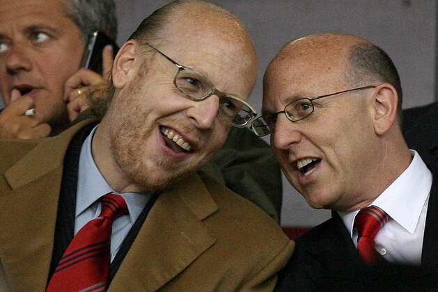 Avi Glazer, left, and Joel Glazer, right, sons of Manchester United owner Malcolm Glazer, take their seats ahead of the match against AC Milan during their Champions League semi final first-leg soccer match at Old Trafford Stadium, Manchester, England, Tuesday April 24, 2007. (AP Photo/Jon Super)