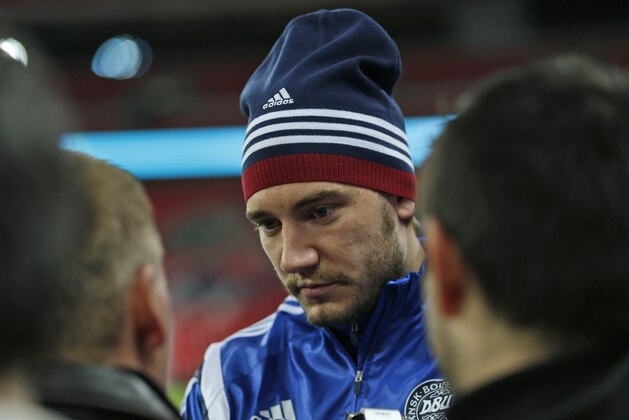 Denmark&#x27;s Nicklas Bendtner talks to members of the media during a training session at Wembley Stadium in London, Monday, March 3, 2014. Denmark will play against England in an international friendly on Wednesday March 5. (AP Photo/Lefteris Pitarakis)