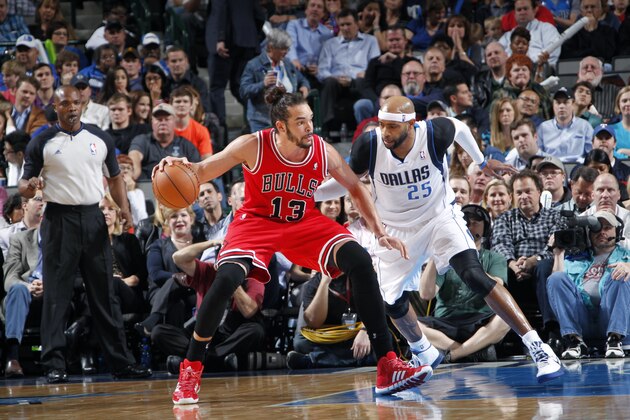 DALLAS, TX - FEBRUARY 28: Joakim Noah #13 of the Chicago Bulls handles the ball against Vince Carter #25 of the Dallas Mavericks on February 28, 2014 at the American Airlines Center in Dallas, Texas. NOTE TO USER: User expressly acknowledges and agrees that, by downloading and or using this photograph, User is consenting to the terms and conditions of the Getty Images License Agreement. Mandatory Copyright Notice: Copyright 2014 NBAE (Photo by Glenn James/NBAE via Getty Images)