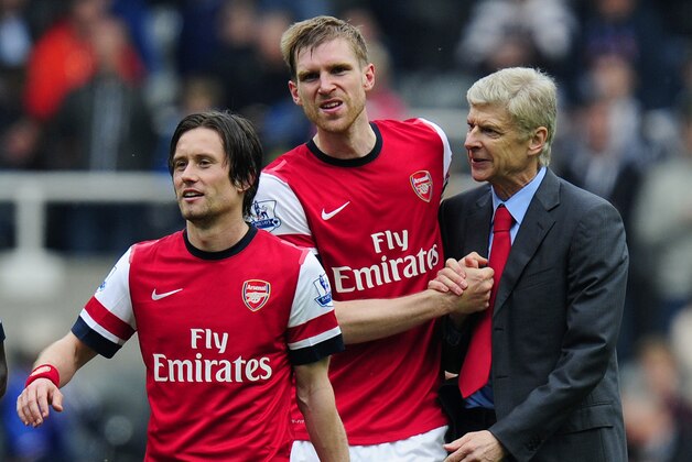NEWCASTLE UPON TYNE, ENGLAND - MAY 19:  Manager Arsene Wenger of Arsenal celebrates at the final whistle with Tomas Rosicky (L) and Per Mertesacker (C) during the Barclays Premier League match between Newcastle United and Arsenal at St James' Park on May 19, 2013 in Newcastle upon Tyne, England.  (Photo by Stu Forster/Getty Images)