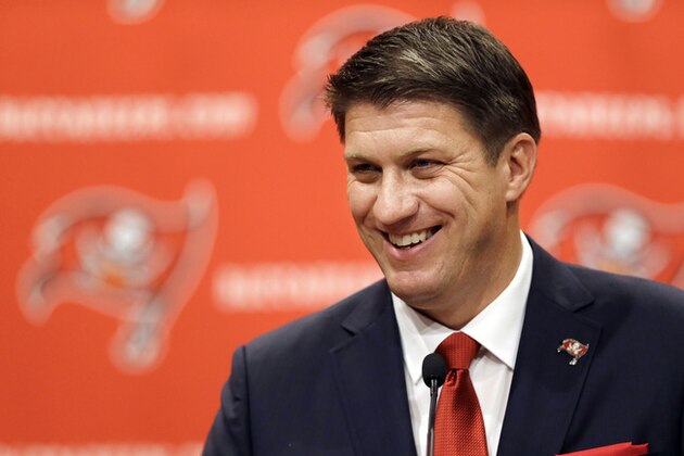 New Tampa Bay Buccaneers general manager Jason Licht smiles during an NFL football news conference Thursday, Jan. 23, 2014, in Tampa, Fla. Licht becomes the fifth general manager in team history.  He takes over a team that hasn't made the playoffs since 2007. (AP Photo/Chris O'Meara)