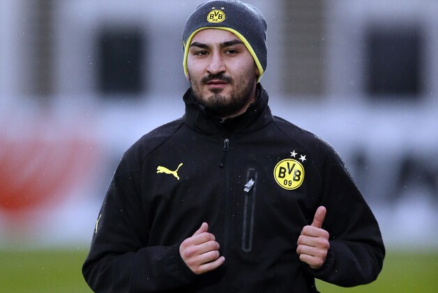 Dortmund's Ilkay Gundogan warms up during a training session one day ahead the Champions League group F soccer match between Borussia Dortmund and Arsenal FC in Dortmund, Germany, Tuesday, Nov. 5, 2013. (AP Photo/Frank Augstein) Dortmund's Ilkay Gundogan warms up during a training session one day ahead the Champions League group F soccer match between Borussia Dortmund and Arsenal FC in Dortmund, Germany, Tuesday, Nov. 5, 2013. (AP Photo/Frank Augstein)