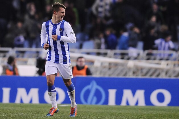 Real Sociedad's Antoine Griezmann of France, smiles after scoring his goal against  FC Barcelona, during the Spanish League soccer match, at Anoeta  stadium in San Sebastian, Spain, Saturday, Feb. 22, 2014. (AP Photo/Alvaro Barrientos)